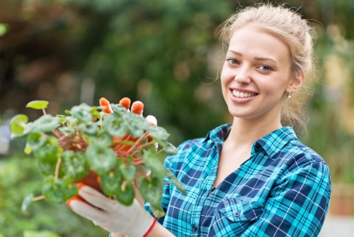 Company representative reviewing modern slavery policy documents with gardeners