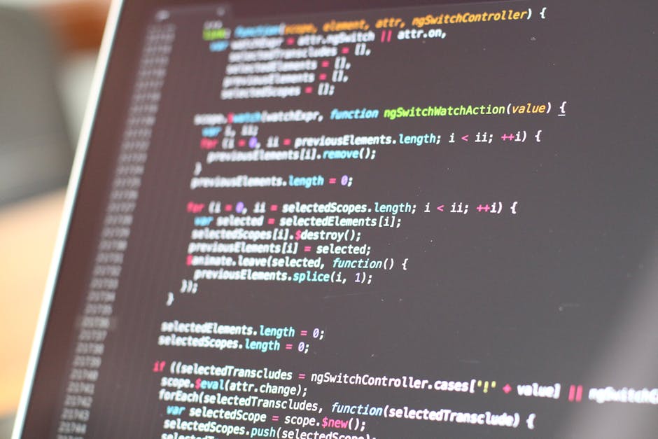 A close-up view of a computer screen displaying lines of colorful programming code, with syntax highlighting in shades of blue, pink, green, and yellow. The code appears to be related to web developme
